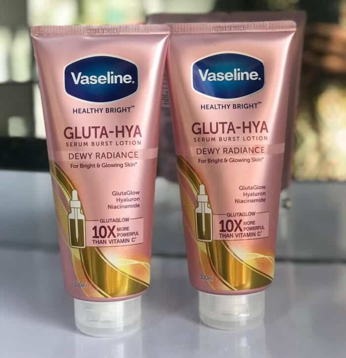 Two pink 330ml tubes of Vaseline Gluta-Hya Dewy Radiance Lotion placed on a table