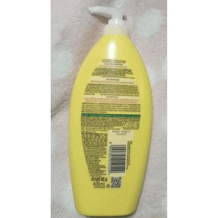 Back view of Garnier Bright Complete Vitamin C Body Serum Lotion yellow bottle, 400ml, showing product details and barcode