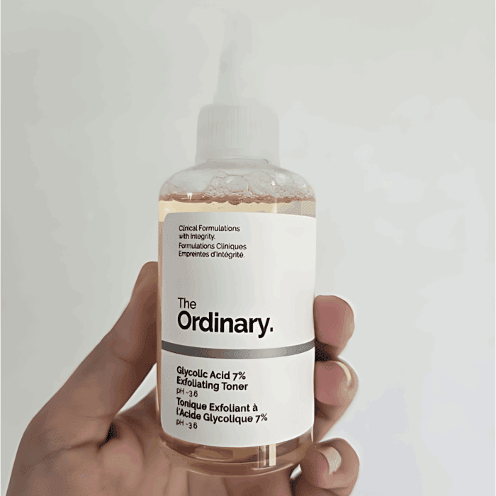 Hand holding The Ordinary Glycolic Acid 7% Exfoliating Toner 100ml with clear label