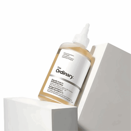 The Ordinary Glycolic Acid 7% Exfoliating Toner (100ml) bottle displayed on angled white blocks.