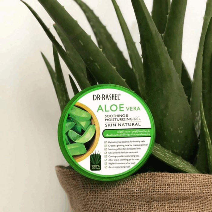 Dr Rashel Aloe Vera Soothing & Moisturizing Gel tub placed in front of a fresh aloe vera plant in a jute pot. Green lid packaging highlights hydration, glowing skin, cooling effect, and multipurpose skincare benefits.