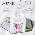 Open jar of Dr Rashel White Skin Fade Spots Night Cream with creamy white texture, placed on a reflective mirror surface. Text highlights benefits: brighten skin tone, moisturize skin, and provide powerful hydration.