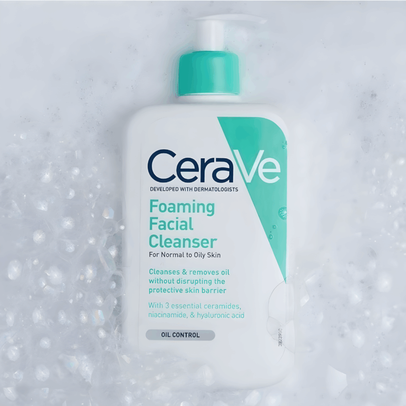 CeraVe Foaming Facial Cleanser bottle on a bed of foamy bubbles.