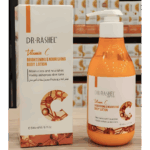 Dr Rashel Vitamin C Brightening & Nourishing Body Lotion bottle placed next to packaging box, displayed on a store counter.