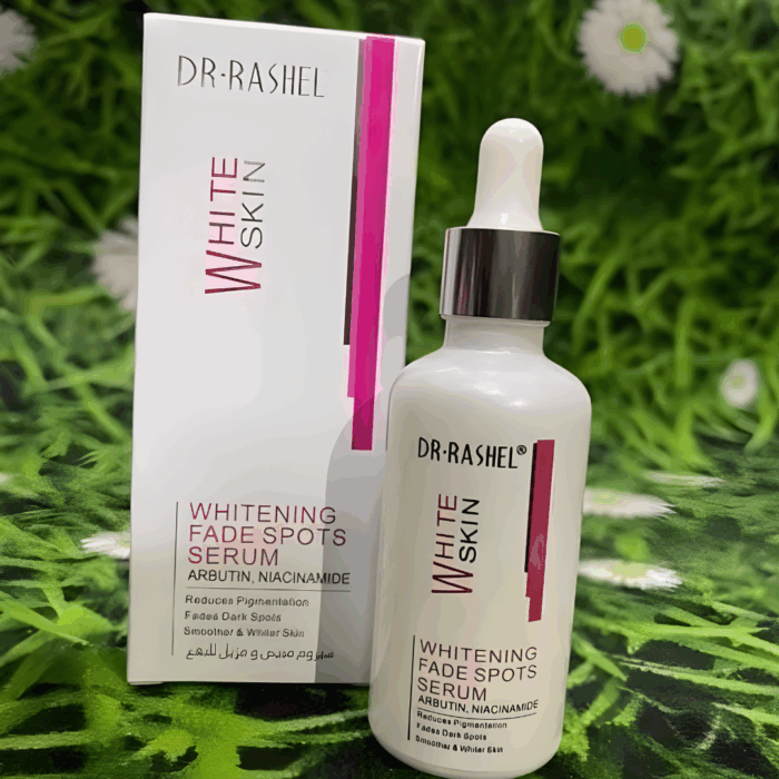 Dr Rashel Whitening Fade Spots Serum bottle with outer packaging on green floral background