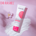 Dr Rashel Body & Private Parts Whitening Cream tube placed on a smear of white cream with soft pink flowers on a pastel pink background.