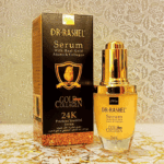Dr. Rashel 24K Gold & Collagen Serum displayed with its black-and-gold box, featuring a gold pump bottle formulated with real gold atoms and collagen to help hydrate, firm, and enhance skin radiance.