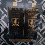 Two Dr. Rashel 24K Gold & Collagen Serum boxes side by side in black-and-gold packaging, labeled “With Real Gold Atoms & Collagen,” presented as a twin pack for skin hydration, firmness, and youthful glow.