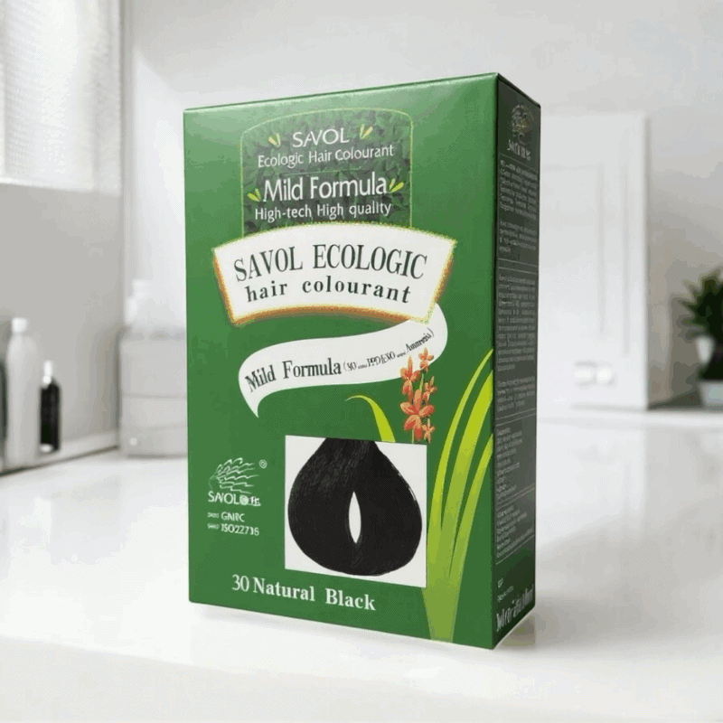 Savol Ecologic Hair Colourant box in green packaging placed on a clean bathroom counter, showing the “30 Natural Black” shade. Highlights include a mild, ammonia-free formula with herbal ingredients for safe, long-lasting hair color.