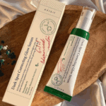 AXIS-Y Dark Spot Correcting Glow Serum and box placed on wooden surface
