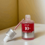 Open Anua Niacinamide 10% TXA 4% serum bottle showing dropper and serum texture