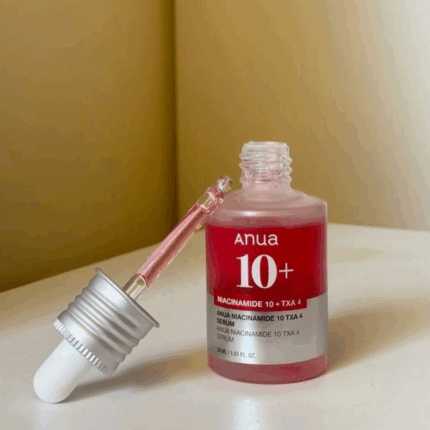 Open Anua Niacinamide 10% TXA 4% serum bottle showing dropper and serum texture