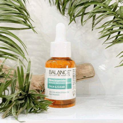 Balance niacinamide calm and clear serum placed with green leaves background