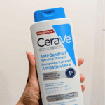 Hand holding CeraVe anti-dandruff hydrating shampoo 355ml with 1% pyrithione zinc for dry, flaky scalp in Sri Lanka