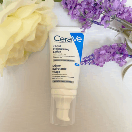 CeraVe PM facial moisturising lotion placed on surface with flowers lifestyle flat lay image