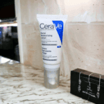 CeraVe PM facial moisturising lotion standing on bathroom counter lifestyle image