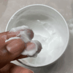 Close-up of Cetaphil Moisturizing Cream texture showing rich, thick consistency