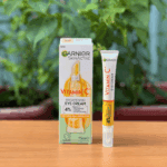 Garnier Vitamin C brightening eye cream tube displayed next to original box packaging