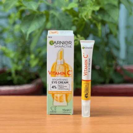 Garnier Vitamin C brightening eye cream tube displayed next to original box packaging