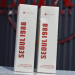Two K-Secret Seoul 1988 snail mucin rice cream retail boxes standing side by side