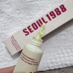 Close up of K-Secret Seoul 1988 eye cream showing retinal liposome formula and nozzle detail