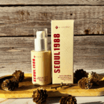 K Secret Seoul 1988 retinal liposome serum bottle and box displayed on wooden surface with pine cones