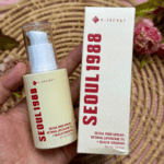 Hand holding K Secret Seoul 1988 retinal liposome serum bottle and product box close view