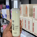 Medicube AGE-R Glutathione Glow Toner held in hand showing product texture and packaging