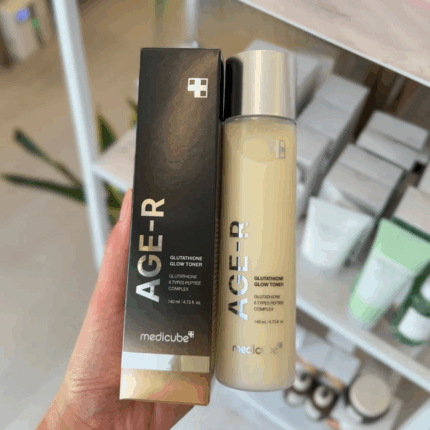 Medicube AGE-R Glutathione Glow Toner held in hand showing product texture and packaging