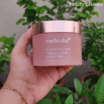 Medicube Collagen Jelly Cream held in hand showing packaging and jar size