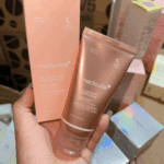 Hand holding Medicube Collagen Night Wrapping Mask tube showing night care skincare product