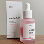 Medicube PDRN Pink Peptide Serum bottle displayed next to original box on table