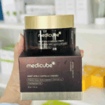 Medicube Deep Vita C Capsule Cream jar placed on product box showing vitamin water and vitamin C derivatives