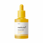 Front view of Medicube Kojic Acid Turmeric Niacinamide Serum dropper bottle on a white background