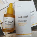 Medicube Kojic Acid Turmeric Niacinamide Serum bottle and box photographed from top view