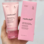Medicube PDRN Pink Caffeine Night Wrapping Mask tube and box held in hand showing authentic packaging