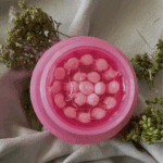Medicube PDRN Pink Collagen Capsule Cream texture showing pink collagen capsules inside jar