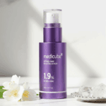 Medicube Retinol NMN Boosting Serum 1.9% displayed with flowers and decorative elements