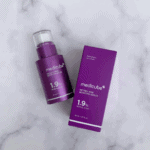 Medicube Retinol NMN Boosting Serum 1.9% bottle placed next to original purple packaging box