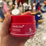 Medicube TXA Niacinamide Capsule Cream 5% held in hand skincare product
