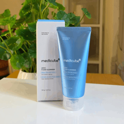Medicube Zero Foam Cleanser displayed with original box on a table next to green indoor plant