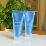 Front and back view of Medicube Zero Foam Cleanser tubes placed side by side on a white surface