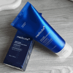 Medicube Zero Pore Blackhead Mud Mask tube placed on box packaging