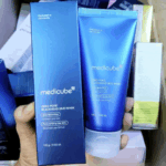 Medicube Zero Pore Blackhead Mud Mask box and tube held in hand