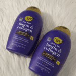 Two OGX Biotin and Collagen shampoo bottles placed on soft background showing volumising hair shampoo packaging