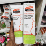 Palmer’s Cocoa Butter stretch marks massage cream tube displayed with box packaging in retail shelf setting