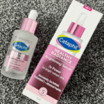 Cetaphil Healthy Radiance Brightening Serum bottle displayed next to original box packaging