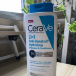 CeraVe 2-in-1 Anti-Dandruff Hydrating Shampoo and Conditioner 355ml bottle with pyrithione zinc placed on table near window for dandruff relief and scalp hydration in Sri Lanka