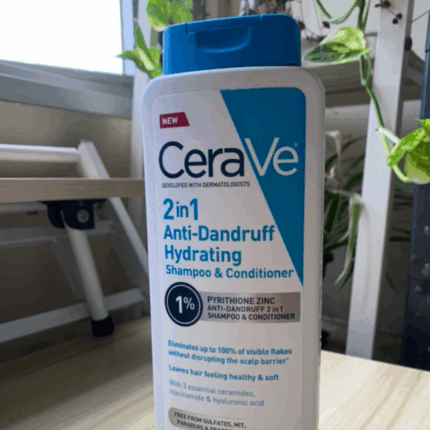 CeraVe 2-in-1 Anti-Dandruff Hydrating Shampoo and Conditioner 355ml bottle with pyrithione zinc placed on table near window for dandruff relief and scalp hydration in Sri Lanka