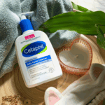 Cetaphil Daily Facial Cleanser 473ml pump bottle with towel leaf and candle skincare flat lay gentle sensitive skin face wash Sri Lanka